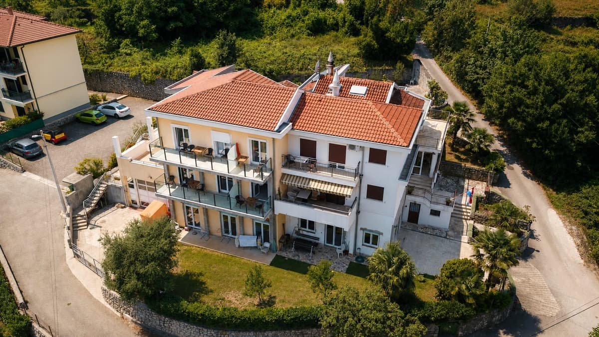 Aerial view of Villa Kubo showing balconies, garden and the parking in front